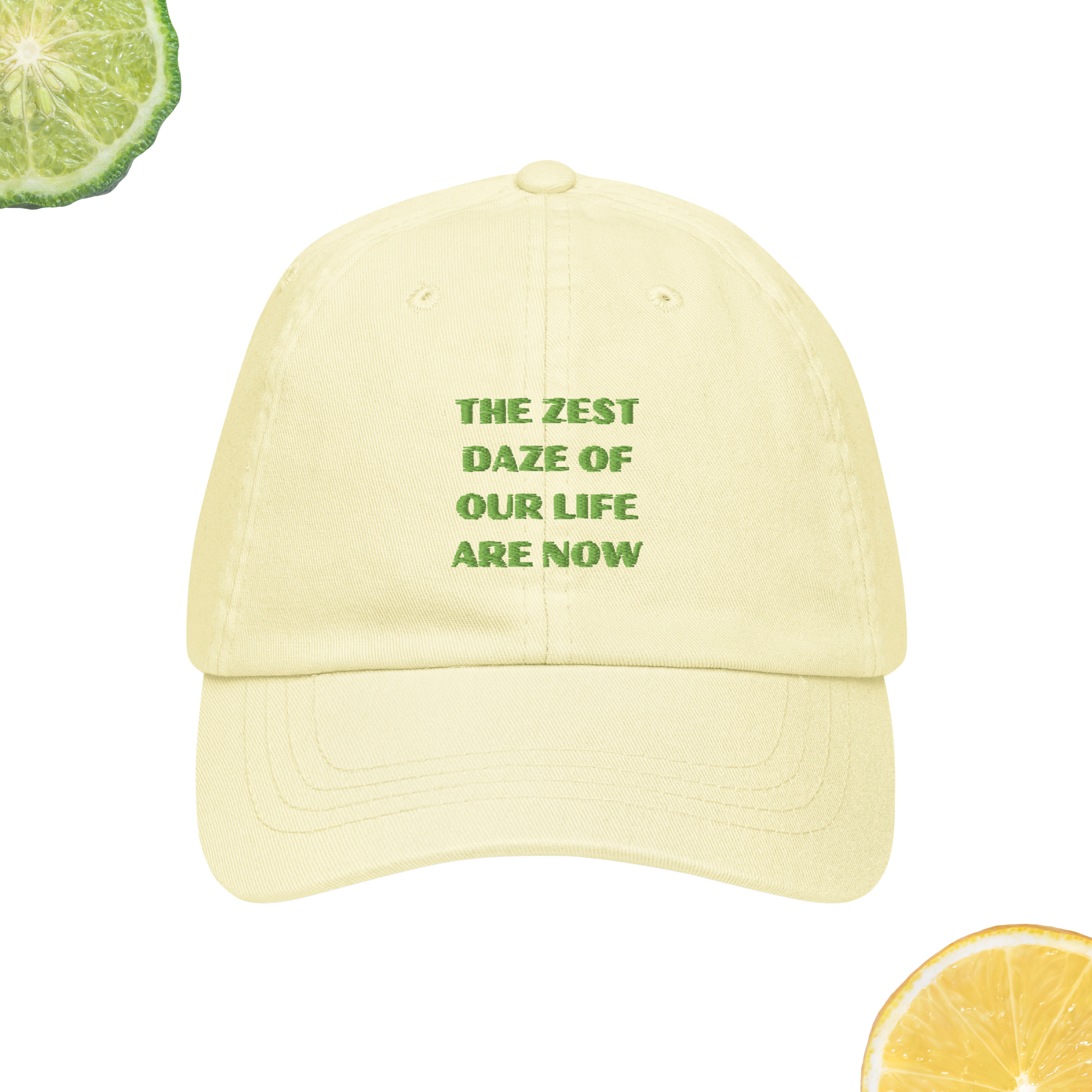 A pastel yellow hat with embroidered words 'The Zest Daze of Our Life Are Now'
